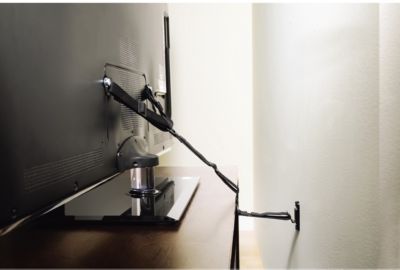 Sangle de sécurité SANUS fixation murale pour TV sur meuble