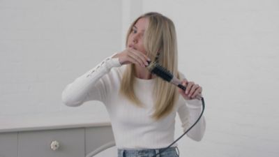 Voir la vidéo pour Brosse chauffante BABYLISS Volume Boost HSB200E