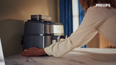 Voir la vidéo pour Airfryer PHILIPS NA555/00 friteuse sans huile double panier + vapeur Métal, Série 5000 9L (3+6L)