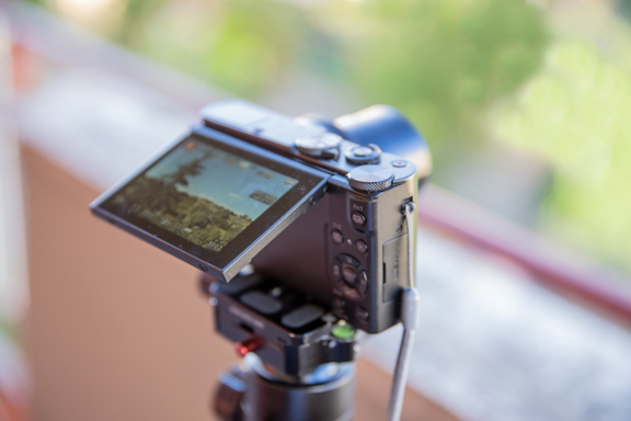 Close-up of Black Premium Digital Compact Pocket Camera Recording Video