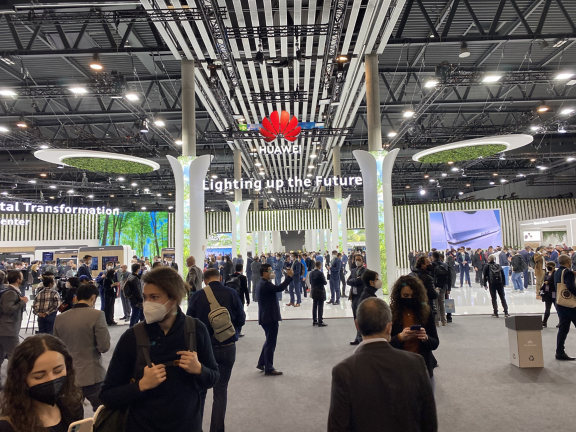 Man changing light bulb in pendant lamp indoors