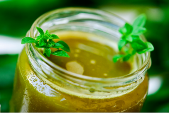 Man changing light bulb in pendant lamp indoors
