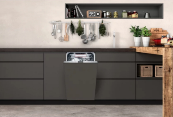 Man changing light bulb in pendant lamp indoors