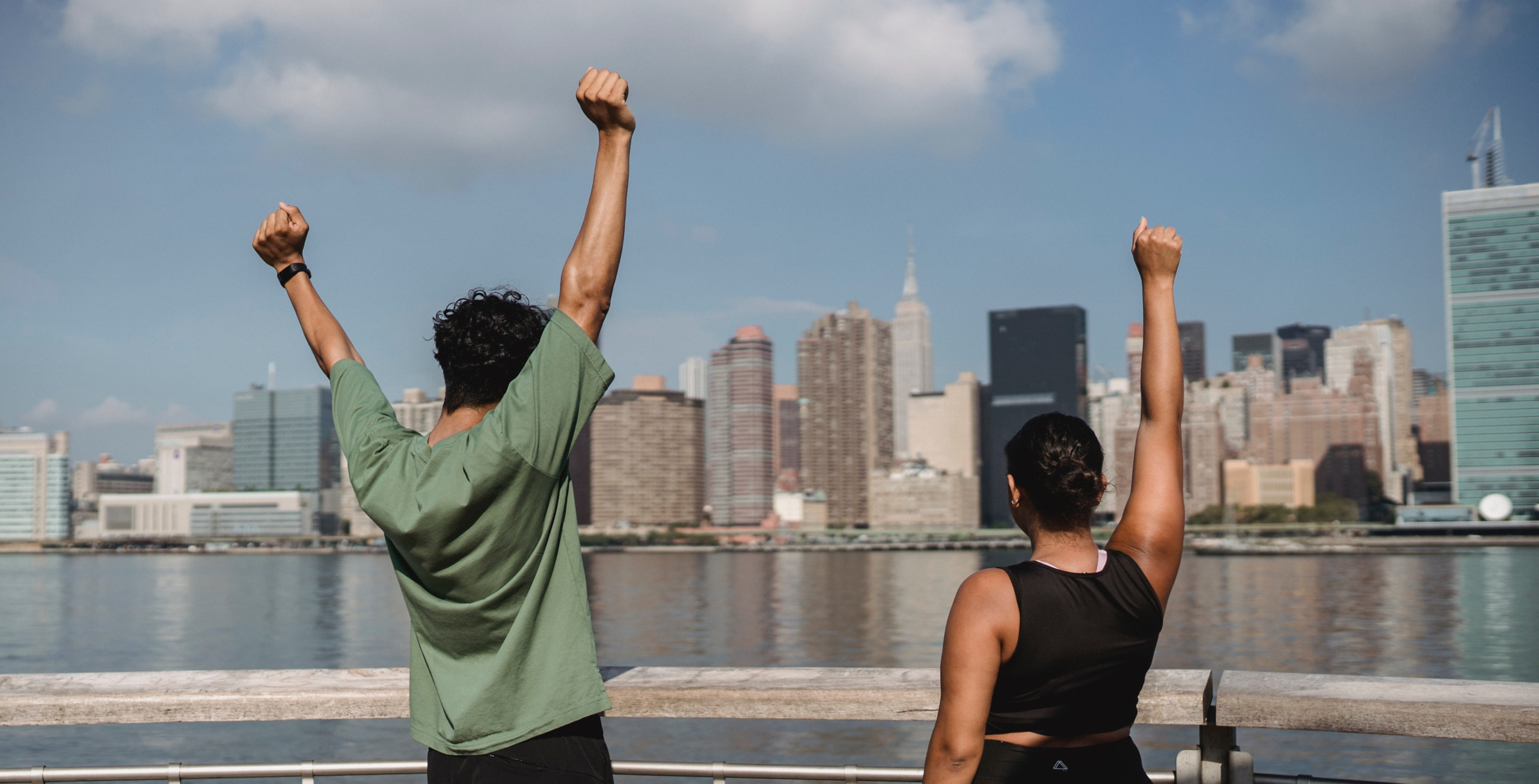 Fitness, sport, friendship and healthy lifestyle concept - group of happy friends or sportsmen exercising