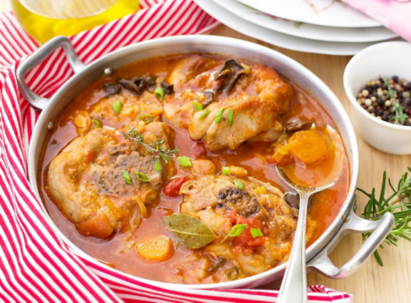 Turkey ossobuco osso bucco in tomato gravy with mushrooms and vegetables
