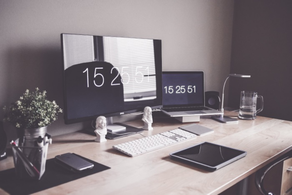 Group of young multiracial business people are working in modern office. Freelancers in coworking place. Creative and stylish youth.