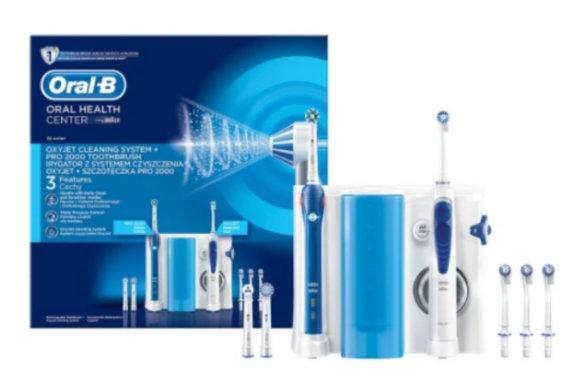 Man changing light bulb in pendant lamp indoors